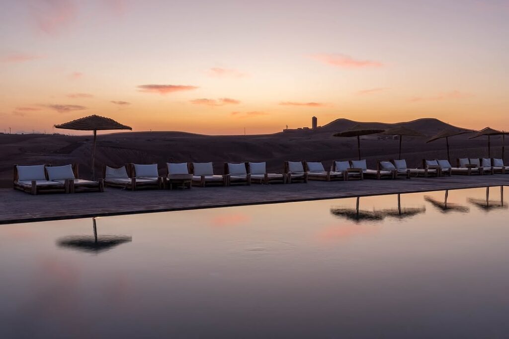 Enjoy Al Kamar in Agafay Desert with pool access, lunch or dinner, sun-bed, towel, and optional camel ride, quad, or buggy experience.Enjoy Al Kamar in Agafay Desert with pool access, lunch or dinner, sun-bed, towel, and optional camel ride, quad, or buggy experience.