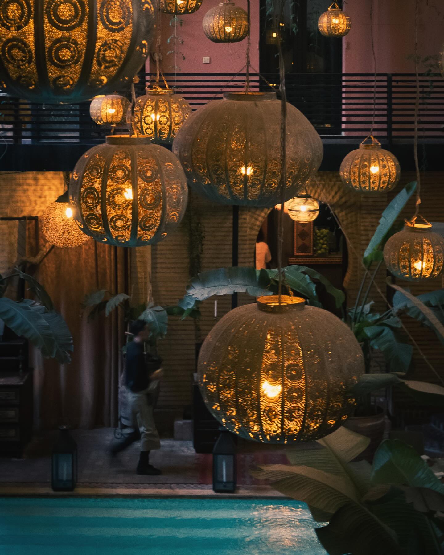 La Trattoria Marrakech entrance gate in Guéliz with palm trees and iconic restaurant sign