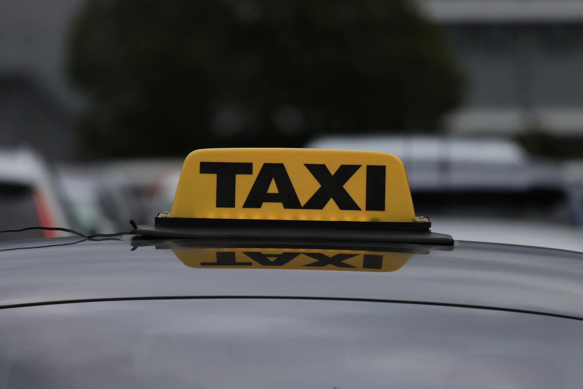 How much is a taxi from Marrakech to Agafay? - A Grand Taxi driving on the rocky road showing how much is a taxi from Marrakech to Agafay costs for travelers