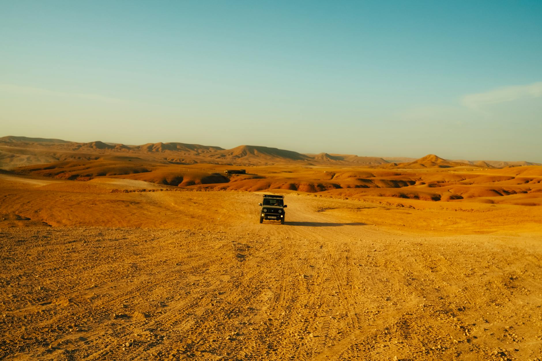A stunning sunset view over the rocky hills of Morocco answering is Agafay desert worth visiting in 2026?