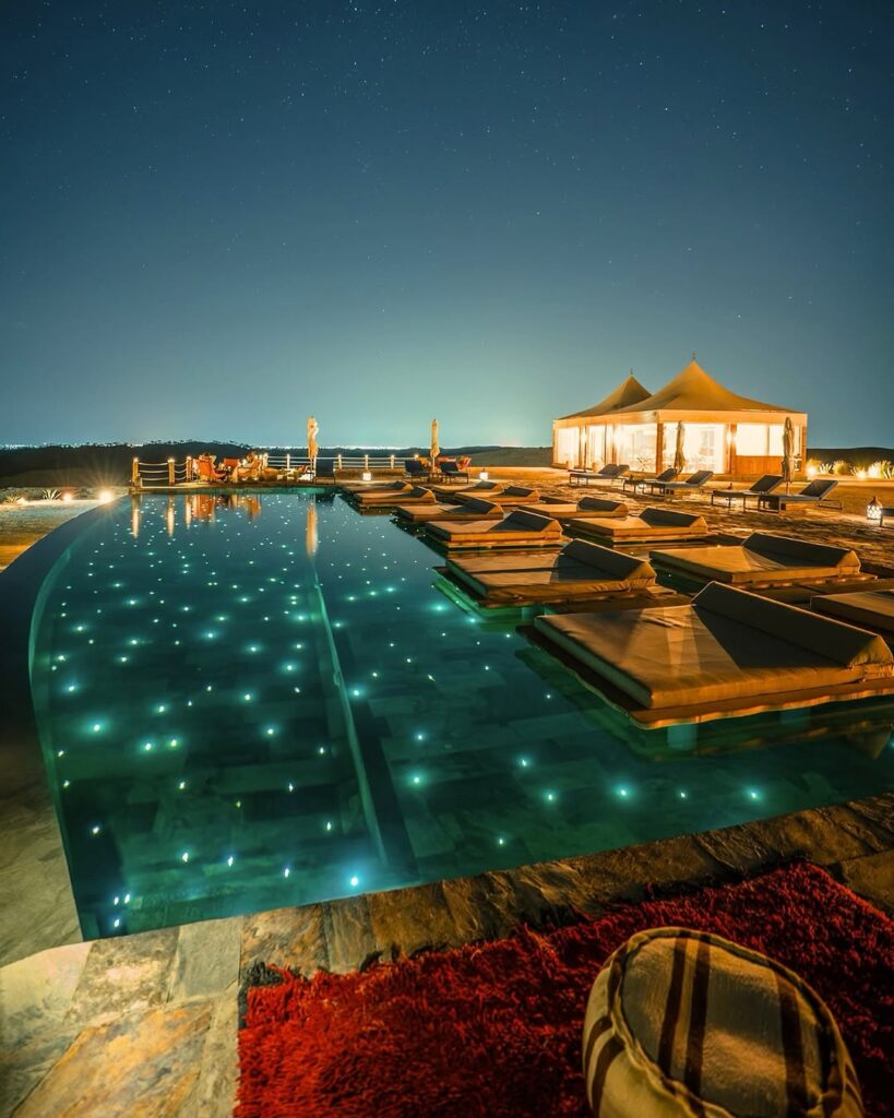 Experience the best agafay daytrip at Seven Saints Agafay Desert. Enjoy luxury pool access, lunch, sunset views, and unforgettable desert vibes near Marrakech.