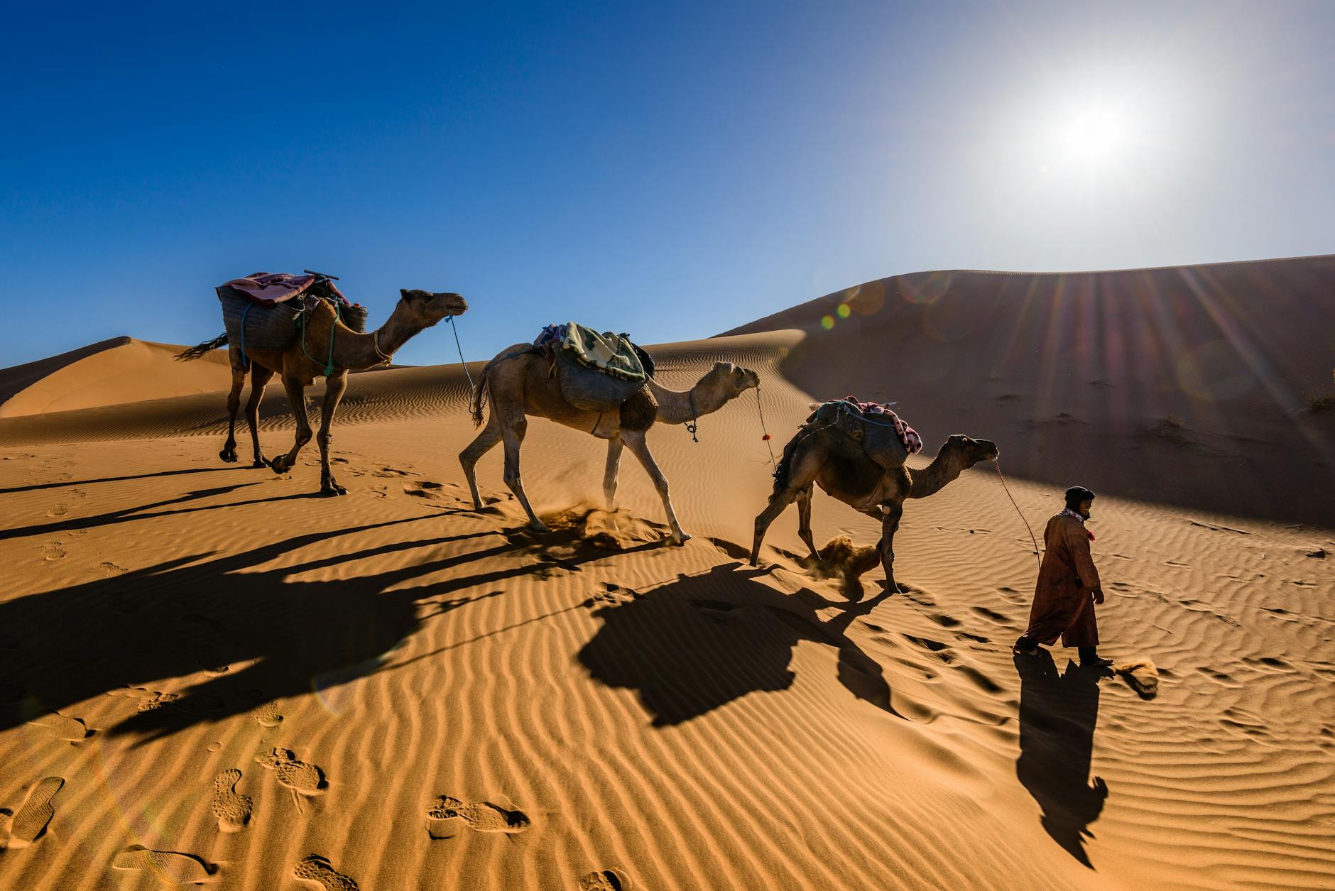 Private luxury van crossing the rocky hills highlighting the marrakech to agafay desert transfer price
